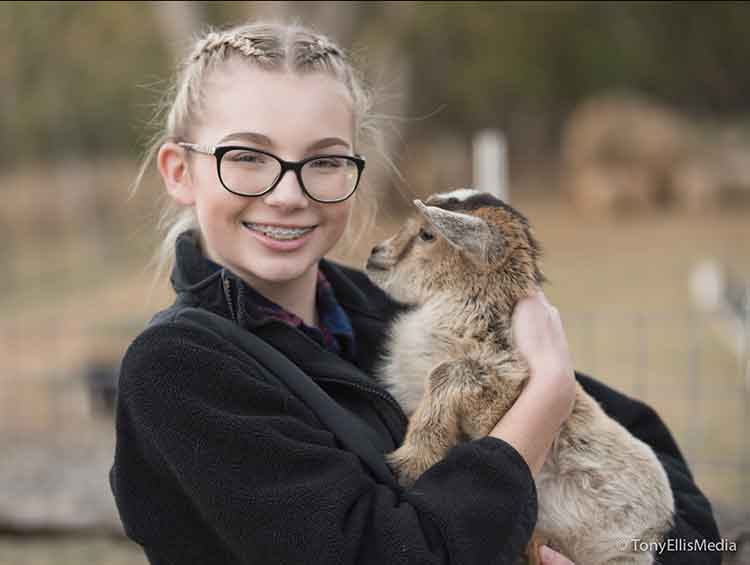 Teenage Girl With Goat